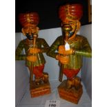 A pair of decorative polychrome carved w