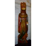 A large polychrome carved wooden Indian