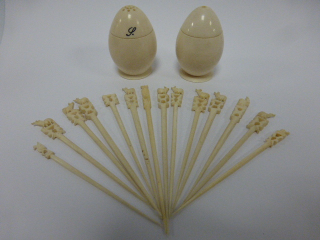 Ivory salt and pepper pots in the form o