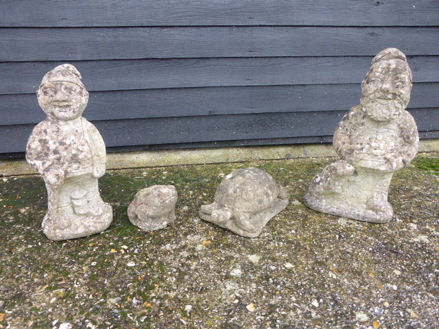 Two garden Gnomes together with a Tortoi