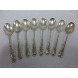 A set of eight silver teaspoons with bea