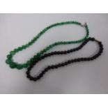 A Chinese green Jade graduated necklace,