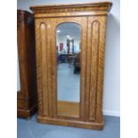 A 19th Century Satinwood Armoire, centre
