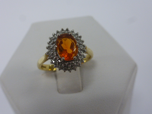 An 18ct gold Fire Opal and Diamond ring,