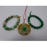 Two Jade bead elasticated bracelets toge