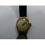 A 9ct gold ladies watch with black patent strap, the case stamped BWC London made 6384, with Swiss
