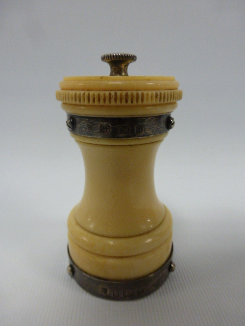 An Ivory pepper grinder with silver moun