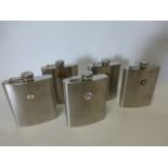 A collection of five stainless steel hip