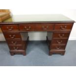 Mahogany pedestal desk with green tooled