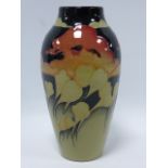 Moorcroft vase decorated red clouds and