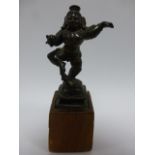 Bronze figure of a Deity dancing and hol