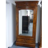 A 19th Century Walnut Armoire, centred b