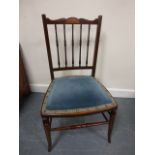 An Edwardian mahogany inlaid upholstered