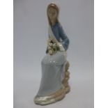 Lladro figure 'Girl sitting with Lilies'