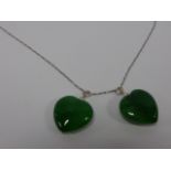 Two Jade heart shaped pendants on a 16-1