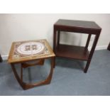 A two tiered occasional table with toole