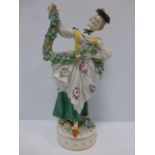 Porcelain figure of a lady in 18thC cost