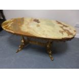 An Onyx coffee table with gilt metal fra