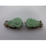 A pair of 19th Century Diamond set carved Jade dress clips with white metal fastenings, each 2.