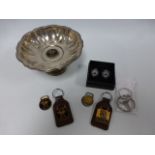 A silver plated Oneida footed bowl with enamelled Mustang badge to centre, a Mustang key fob,
