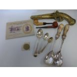 An eclectic mix of items to items two Georgian silver spoons, plated items,
