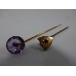 A French 18ct gold pin with faceted Amethyst finial, Eagle head hallmark, 7cms in length,