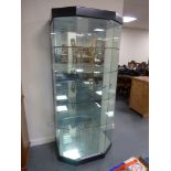 Glazed display cabinet with internal lights, mirrored back four glass shelves,