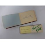 Two Autograph books containing various signatures including Harold Wilson, Hughie Green,