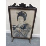 A late 19th/early 20th century fire screen with central portrait image of a Japanese woman in