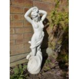 Garden statue of a semi naked maiden,