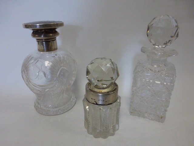 Large cut glass waisted scent bottle with silver collar and replaced tortoiseshell effect centre,