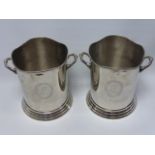 A pair of twin handled Louis Roederer silver plated wine coolers, each 23cms in height