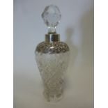 An elegant Edwardian silver collared cut glass scent bottle of tapering form on octagonal base,