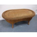 An oval Wicker coffee table,