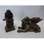 Cast metal seated Ape reading a book 18cm high,
