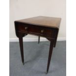 A 19th century mahogany Pembroke table, with single frieze drawer and lion mask handles,