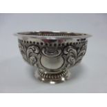 A Continental 930 silver footed bowl with embossed foliate decoration and vacant cartouches between