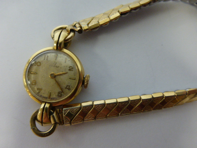Ladies 14ct gold Omega 15jewel wristwatch, with circular dial, Arabic and baton numerals,