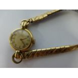 Ladies 14ct gold Omega 15jewel wristwatch, with circular dial, Arabic and baton numerals,