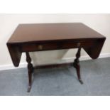 A Strongbow flame mahogany sofa table with inlaid and crossbanded detailing and twin frieze drawers,