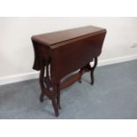 An Edwardian mahogany Sutherland table with shaped drop leaf top and canted corners,