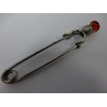 Scottish white metal kilt pin with thistle finial set with amber coloured paste stone