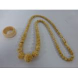 Carved Ivory bead necklace together with an Ivory ring