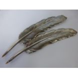 A pair of 925 silver pens in the form of feathered quills, 23cms in length