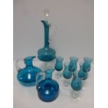 A kingfisher blue and clear glass decanter with six matching glasses, together with two