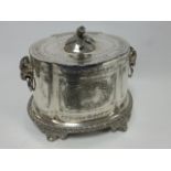 A 19th Century silver plated tea caddy of oval form with Rams head and ring handles,