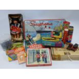 Collection of vintage games and toys including die-cast vehicles and a Supreme QEII paint box