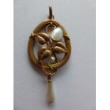 An Art Nouveau 9ct gold pendant set with Pearls, 4.8cms in length including bale, 2.
