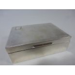 Silver cigarette box with engine turned decoration to hinged lid,