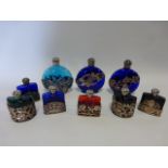 Collection of nine scent bottles with silver plated decoration